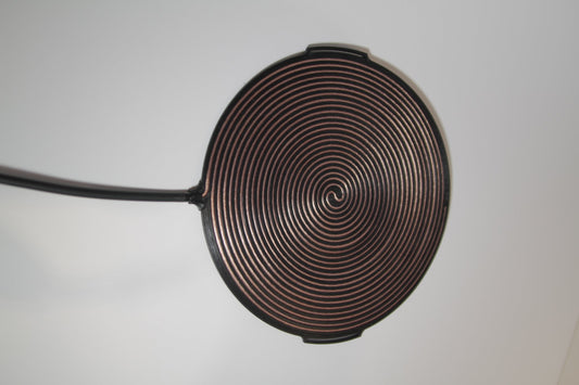 Gandr bifilar pancake coil at an angle with its 2.5 m lead cable and gold-plated banana plug