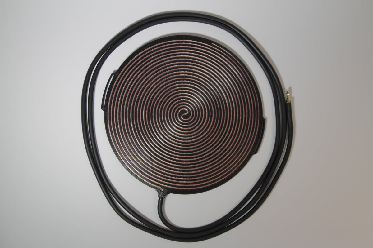 Gandr coil from above with the lead cable coiled beside it, showing full cable length